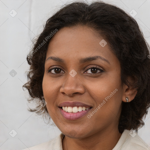 Joyful black young-adult female with medium  brown hair and brown eyes