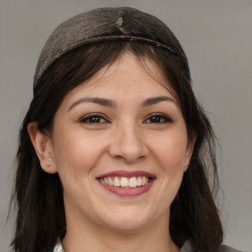 Joyful white young-adult female with medium  brown hair and brown eyes