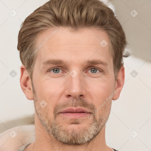 Joyful white adult male with short  brown hair and grey eyes