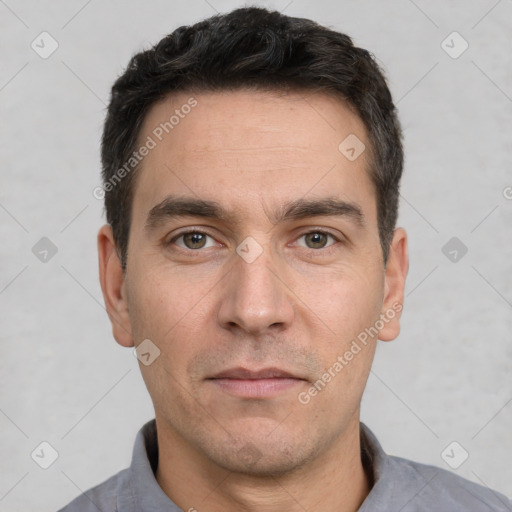 Neutral white adult male with short  black hair and brown eyes