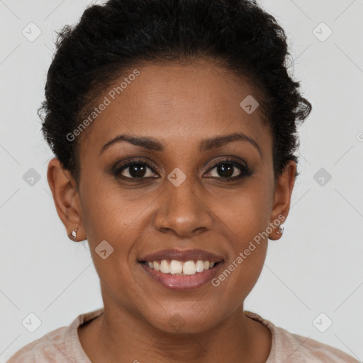 Joyful black young-adult female with short  brown hair and brown eyes