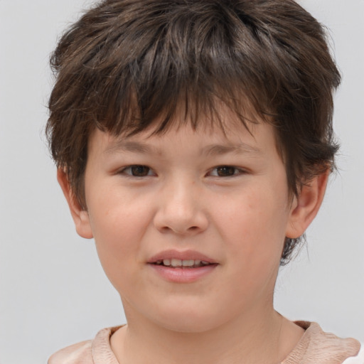Joyful white child male with short  brown hair and brown eyes