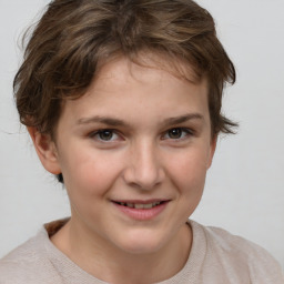 Joyful white child female with short  brown hair and brown eyes