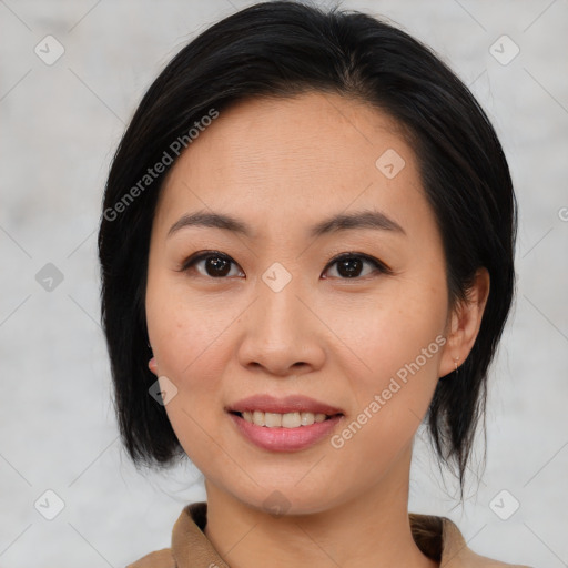 Joyful asian young-adult female with medium  black hair and brown eyes