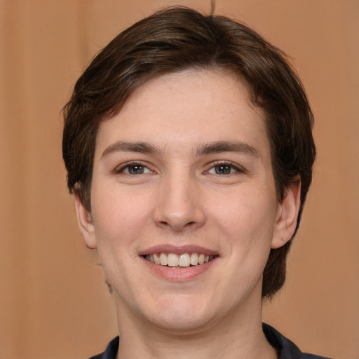 Joyful white young-adult male with medium  brown hair and brown eyes