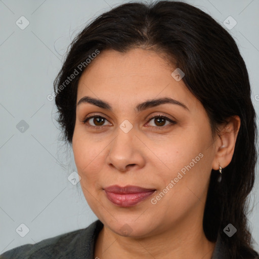 Joyful latino young-adult female with medium  brown hair and brown eyes