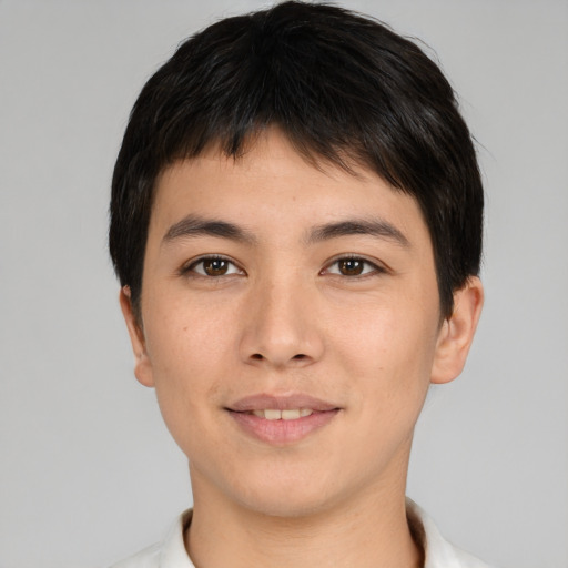 Joyful asian young-adult male with short  brown hair and brown eyes