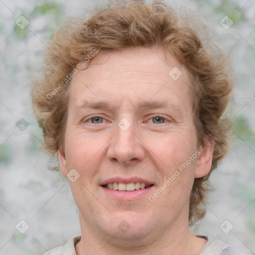 Joyful white adult female with medium  brown hair and blue eyes