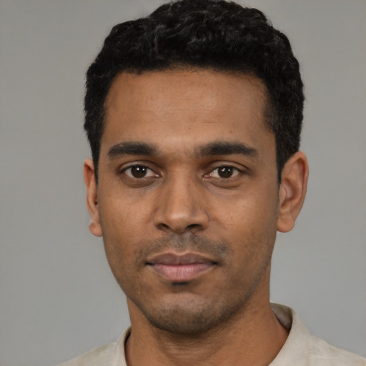 Neutral black young-adult male with short  black hair and brown eyes