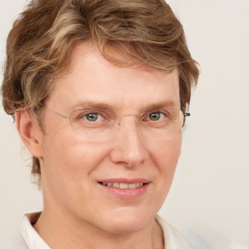 Joyful white adult male with short  brown hair and grey eyes