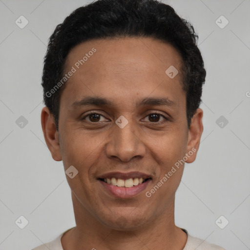 Joyful latino young-adult male with short  black hair and brown eyes