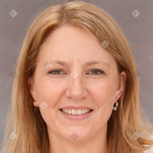 Joyful white adult female with long  brown hair and brown eyes