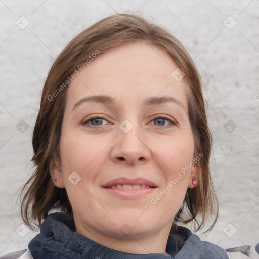 Joyful white young-adult female with medium  brown hair and blue eyes