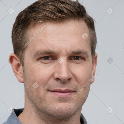 Joyful white adult male with short  brown hair and grey eyes