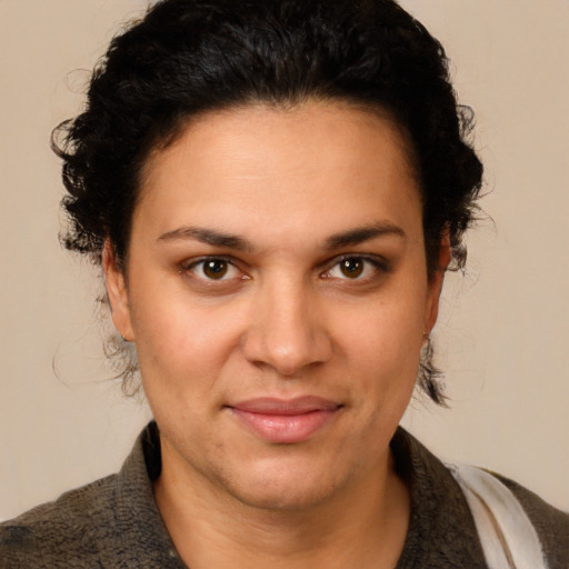 Joyful white adult female with short  brown hair and brown eyes