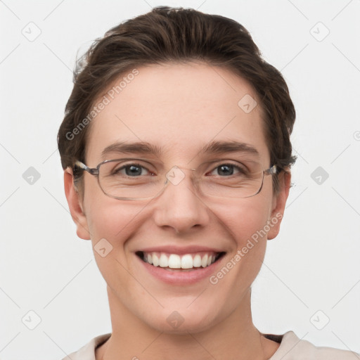 Joyful white young-adult female with short  brown hair and grey eyes