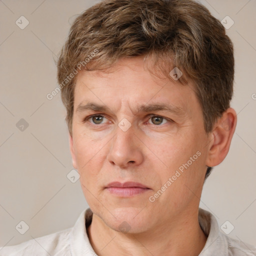 Joyful white adult male with short  brown hair and grey eyes