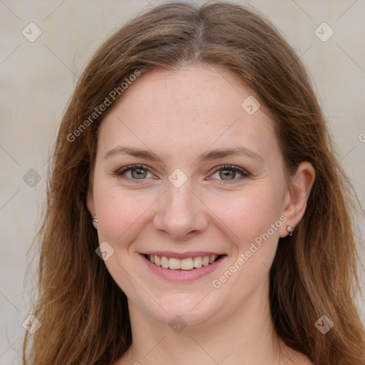 Joyful white young-adult female with long  brown hair and green eyes