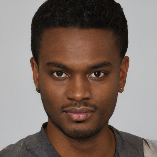 Neutral black young-adult male with short  brown hair and brown eyes