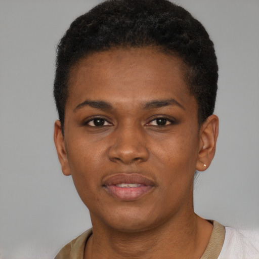 Joyful black young-adult female with short  brown hair and brown eyes