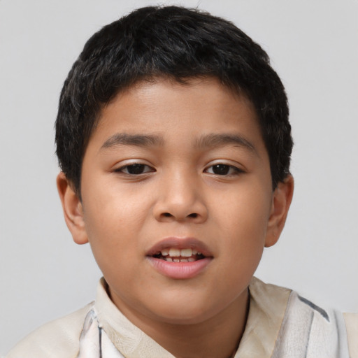 Joyful asian child male with short  brown hair and brown eyes