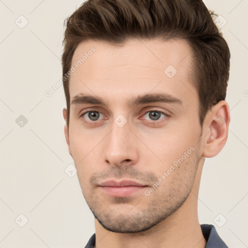 Neutral white young-adult male with short  brown hair and brown eyes