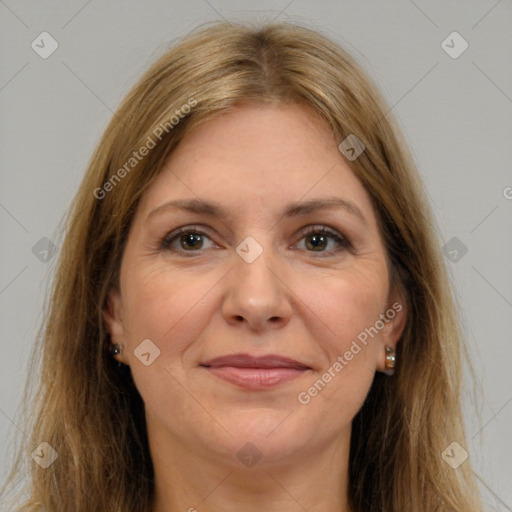 Joyful white adult female with long  brown hair and brown eyes