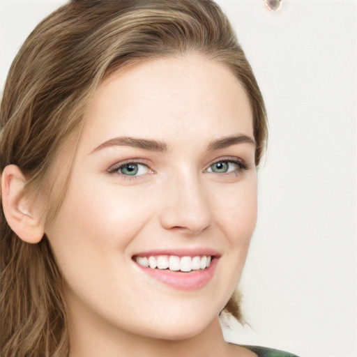 Joyful white young-adult female with long  brown hair and green eyes