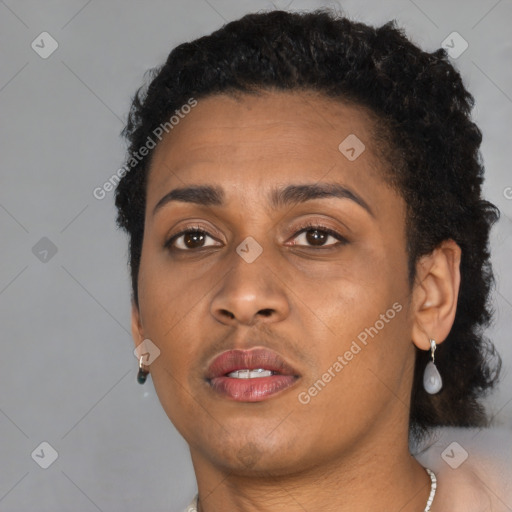 Joyful black young-adult female with short  brown hair and brown eyes