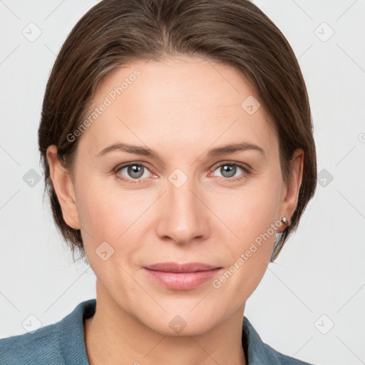 Joyful white young-adult female with medium  brown hair and grey eyes