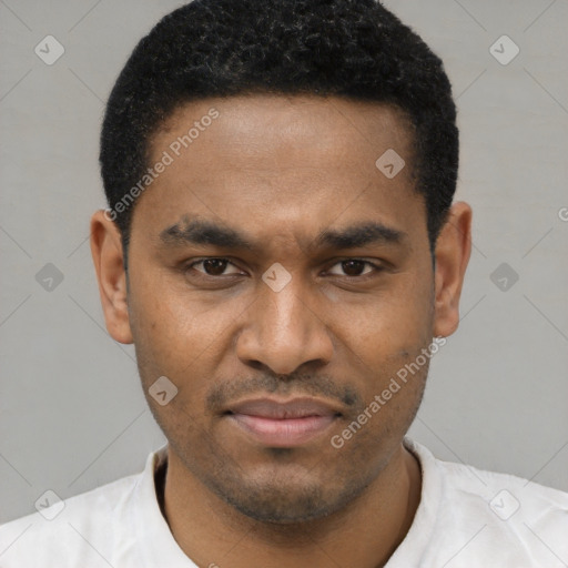 Joyful black young-adult male with short  black hair and brown eyes