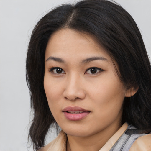 Neutral asian young-adult female with medium  brown hair and brown eyes