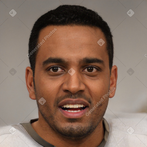 Joyful black young-adult male with short  black hair and brown eyes