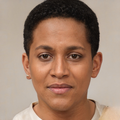 Joyful black young-adult female with short  black hair and brown eyes