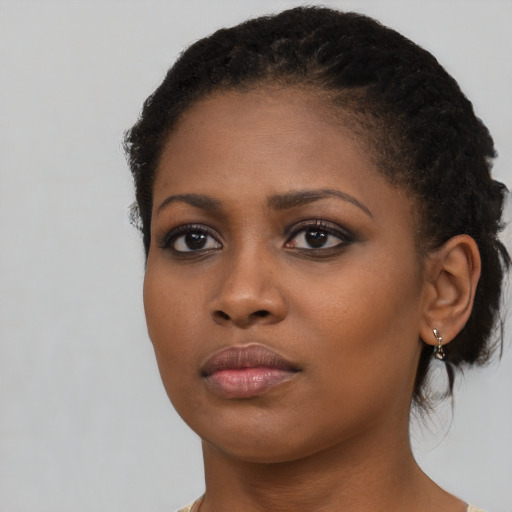 Neutral black young-adult female with short  black hair and brown eyes
