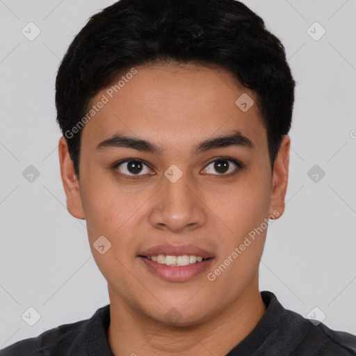 Joyful latino young-adult male with short  black hair and brown eyes