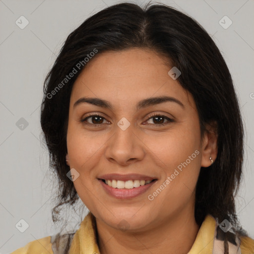 Joyful latino young-adult female with medium  brown hair and brown eyes