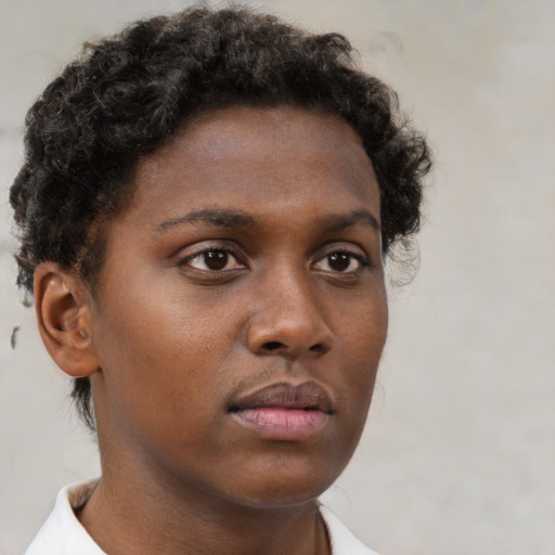 Neutral black young-adult female with short  brown hair and brown eyes