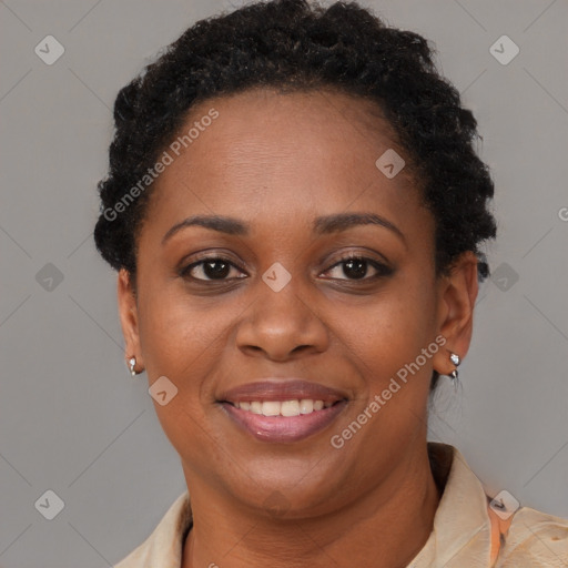 Joyful black young-adult female with short  brown hair and brown eyes