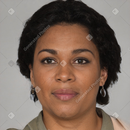 Joyful black adult female with short  brown hair and brown eyes