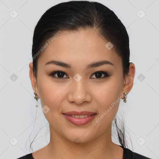 Joyful latino young-adult female with medium  brown hair and brown eyes