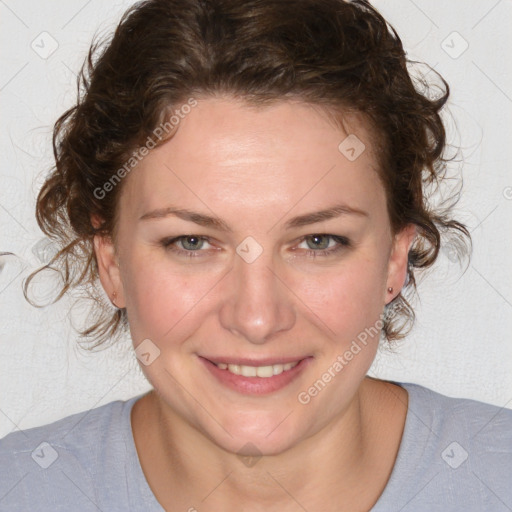 Joyful white young-adult female with medium  brown hair and blue eyes