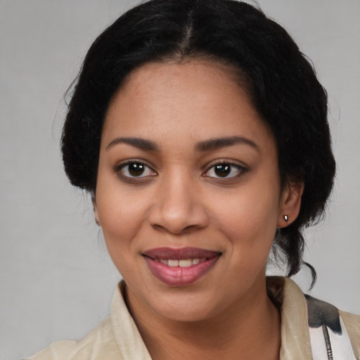 Joyful latino young-adult female with medium  black hair and brown eyes