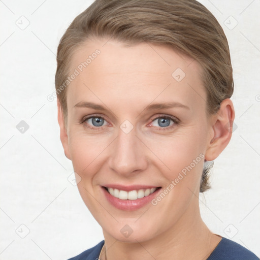 Joyful white young-adult female with short  brown hair and grey eyes