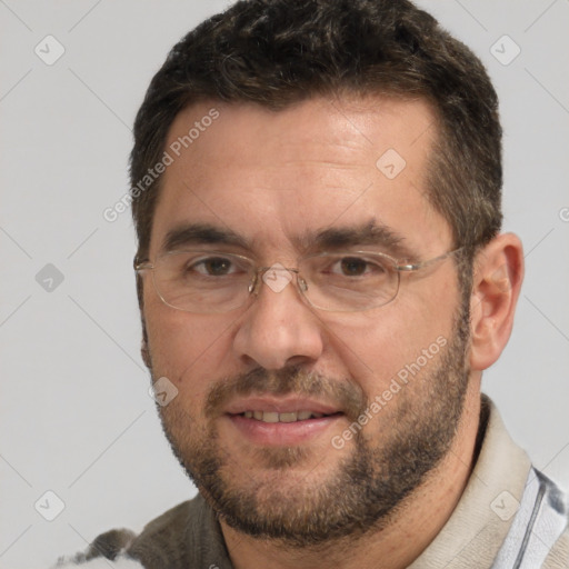 Joyful white adult male with short  brown hair and brown eyes