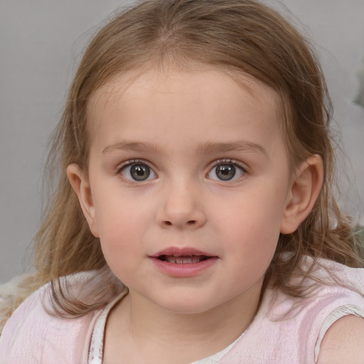 Joyful white child female with medium  brown hair and blue eyes