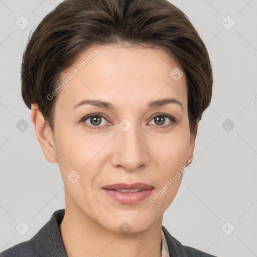 Joyful white young-adult female with short  brown hair and grey eyes