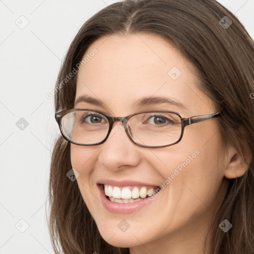 Joyful white young-adult female with long  brown hair and grey eyes