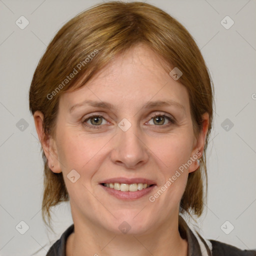 Joyful white adult female with medium  brown hair and grey eyes