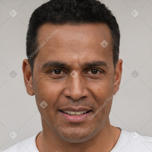 Joyful latino adult male with short  black hair and brown eyes